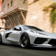 Forza Horizon 5 cars race down a Mexico City street.
